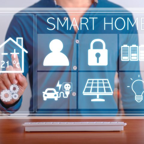 Modern technology for the smart home. Man using the control panel of his smart home.